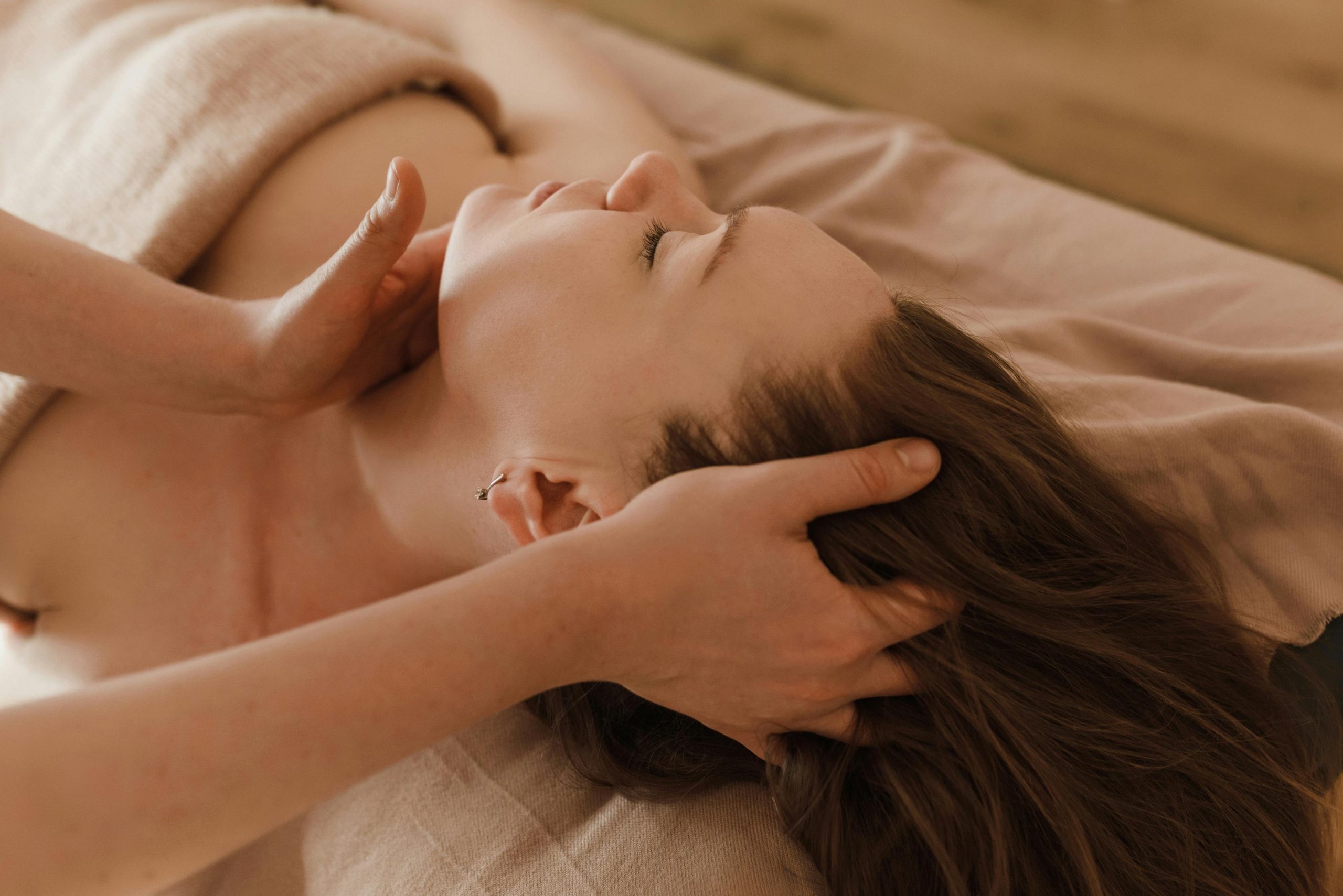 Relaxation treatment of neck and head A women receives osteopathy treatment
